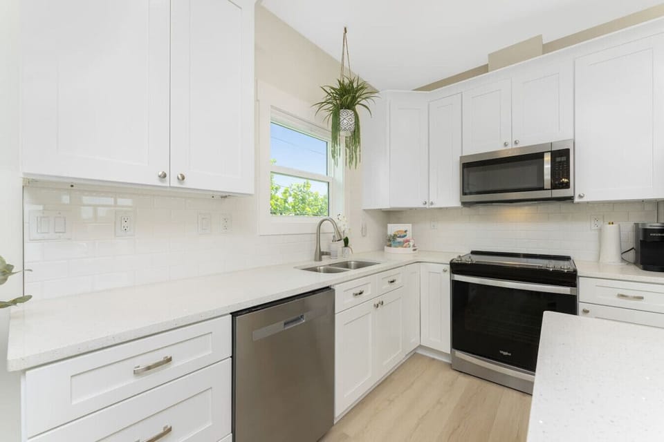 Kitchen has Dishwasher, Small Appliances,  Cooking Utensils, Pots and Pans