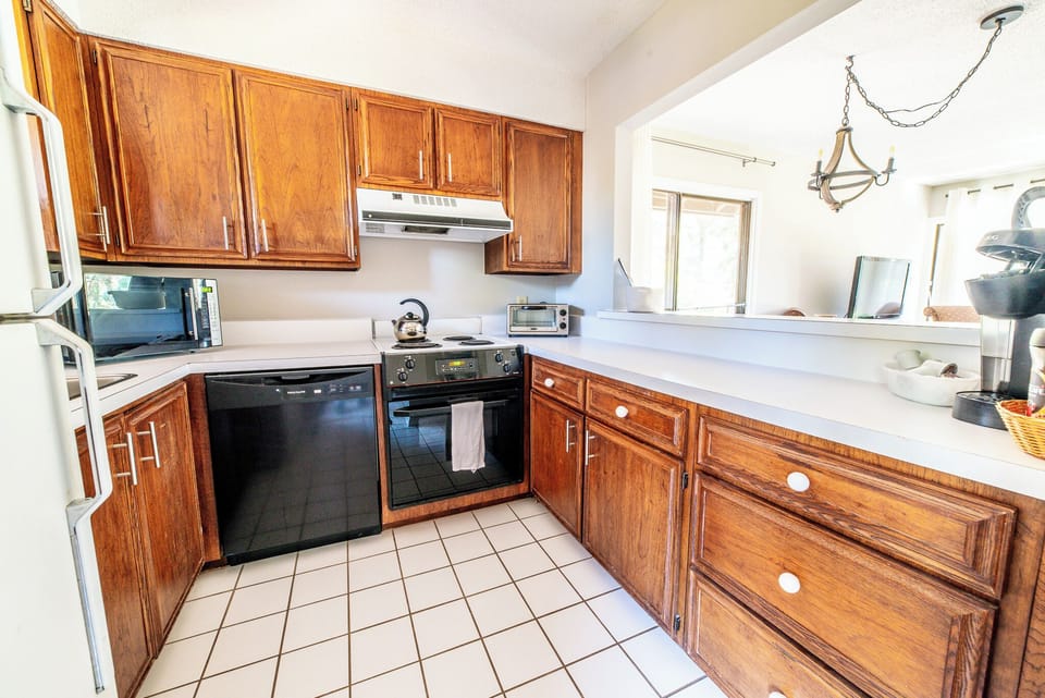 Kitchen with new oven and stove, and keurig coffee maker