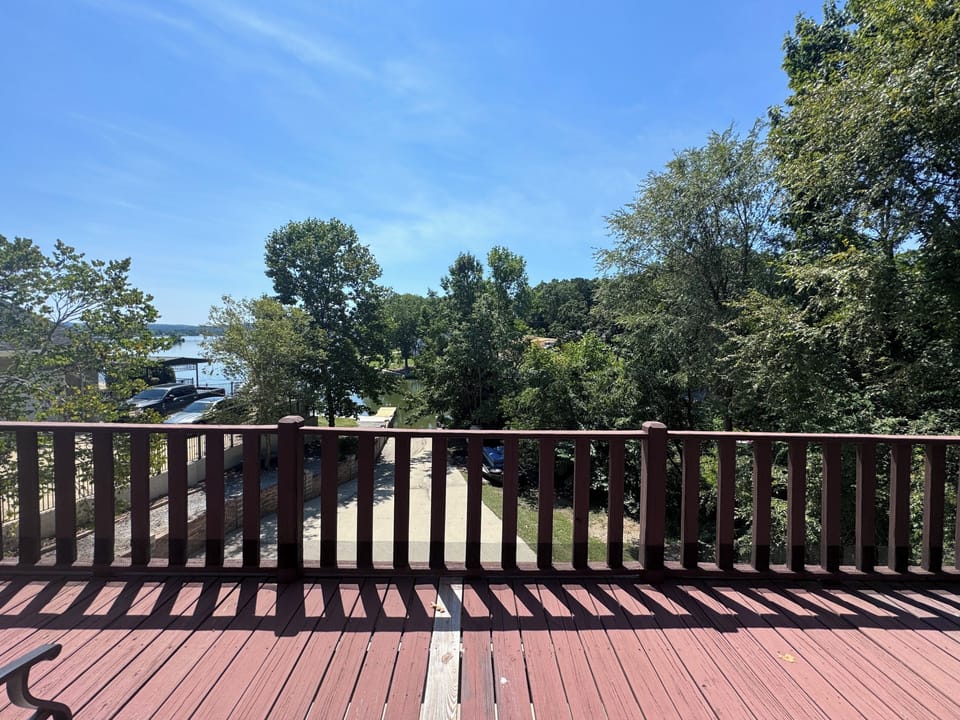 Balcony off Master Bedroom. View of Boat ramp, dock, and lake.  