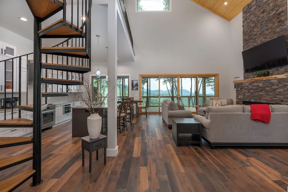 Living room with large gas fireplace and beautiful mountain views