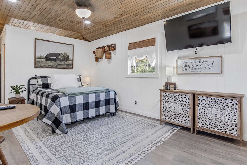 A big queen-sized bed, covered in clean linens, comfortably sleeps two. Ask us about our rollaway bed option for one more person!