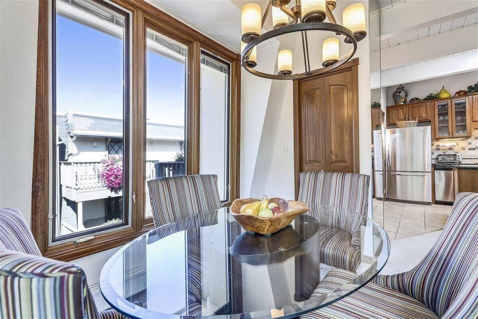 Separate dining area nestled in a bay of windows
