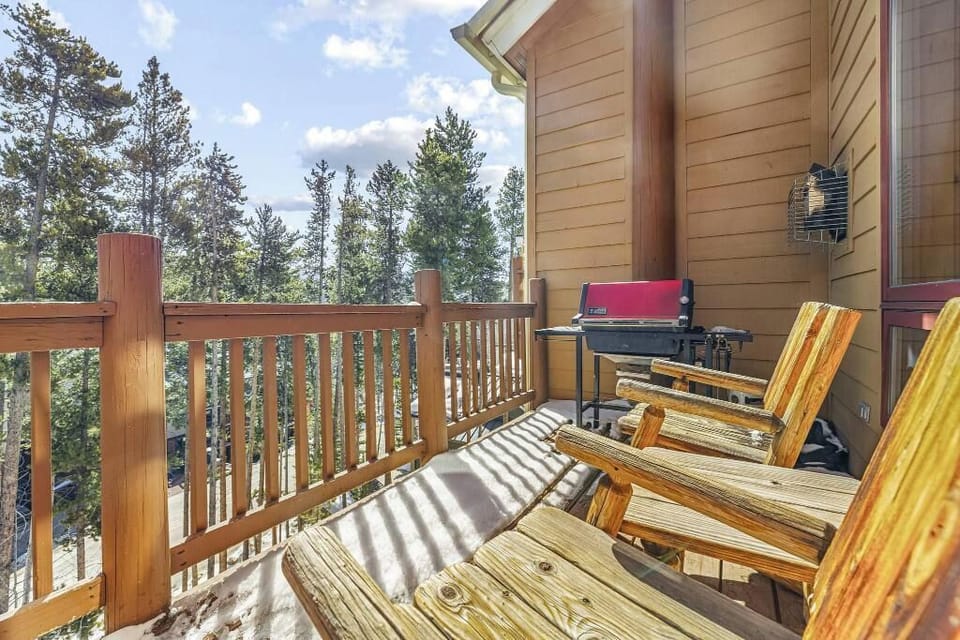 Spacious balcony off of living room with gas grill