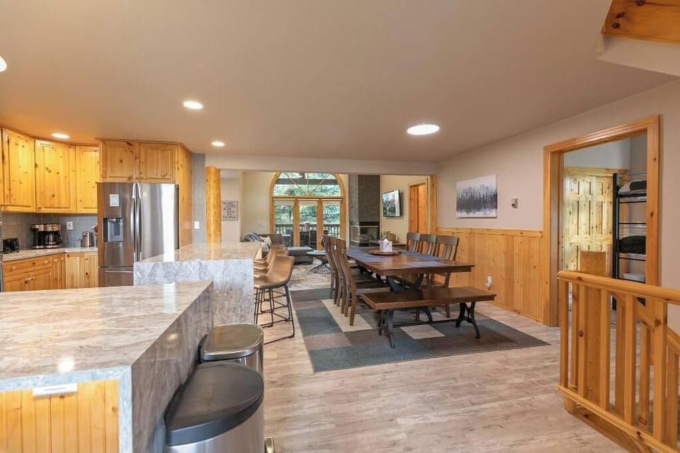 The kitchen sits between the living room and family room