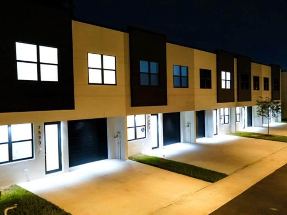 This modern complex provides a single garage for each unit plus driveway parking