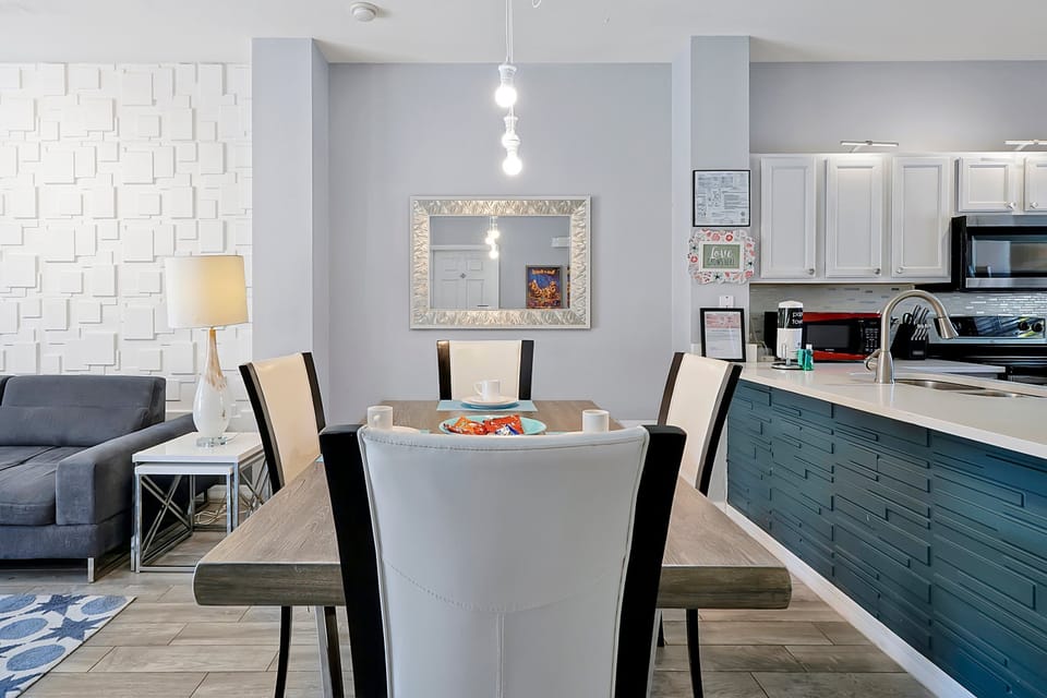 Ultra-modern and ready to host. Our bright, fully equipped kitchen features a chic central island/bar, perfect for quick breakfasts or socializing while preparing meals.