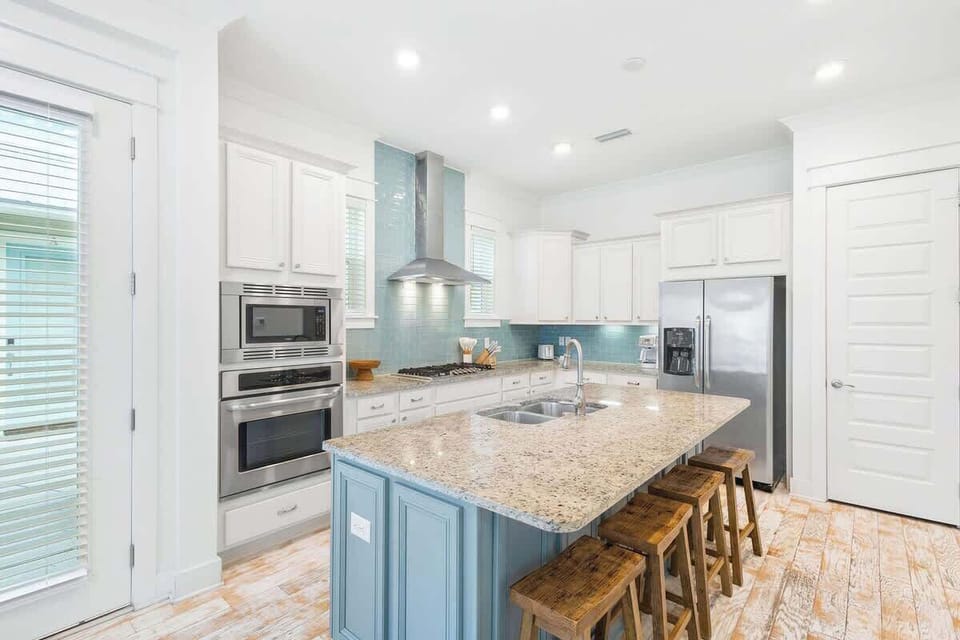 Large kitchen island includes seating for 4.
