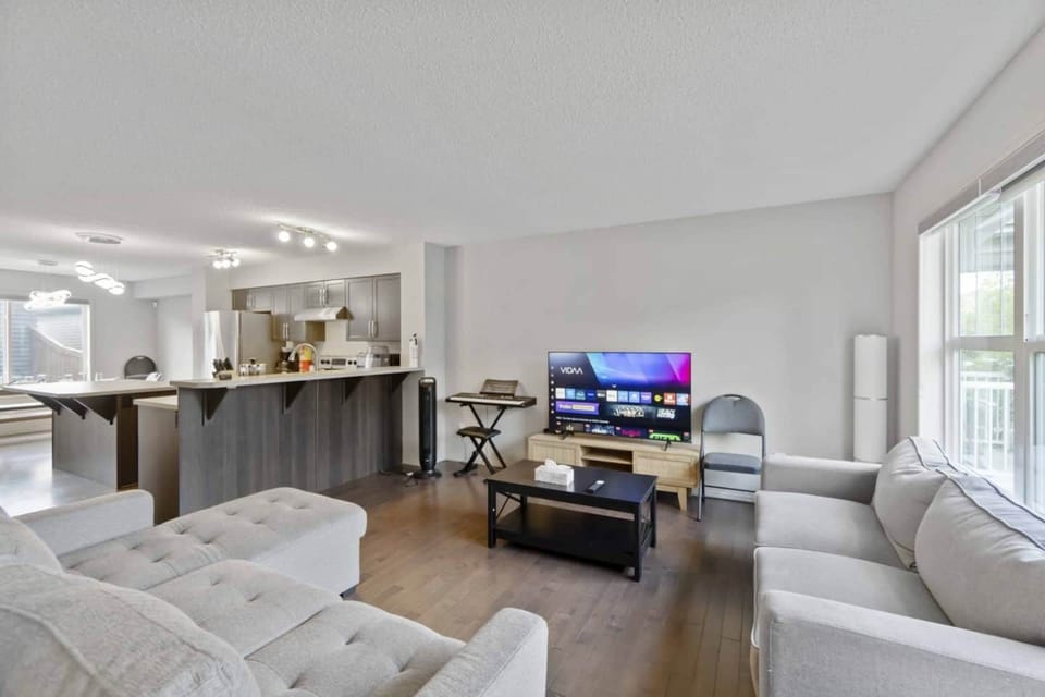Living Room - Double Sofa Bed, Couch, 60" Smart ULED TV and Piano