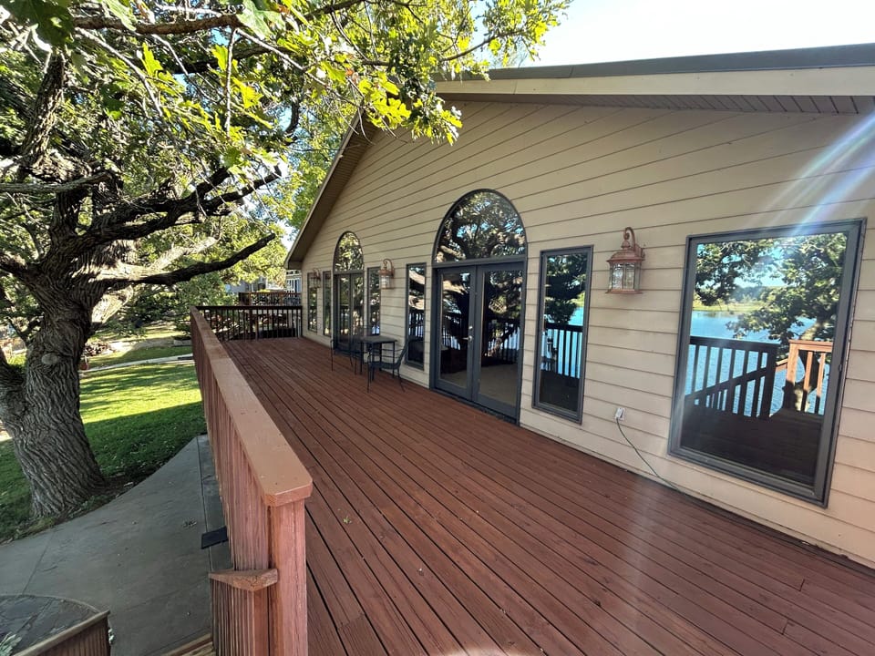 Both Master Suites have French door access to gorgeous upper-deck view of lake.