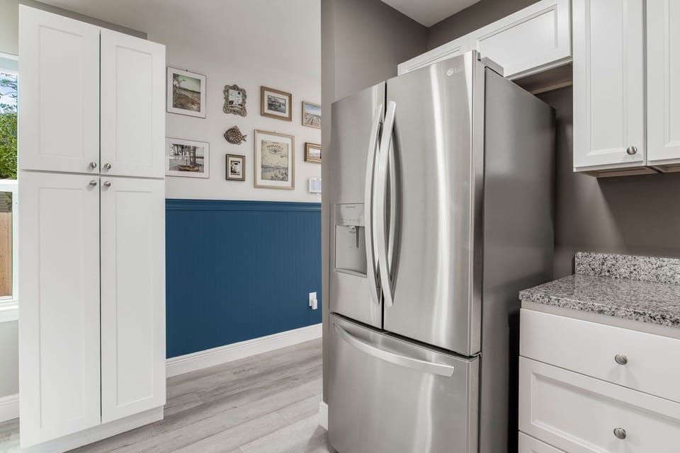 Full-size refrigerator and ample cabinetry keep everything neat and accessible during your stay.