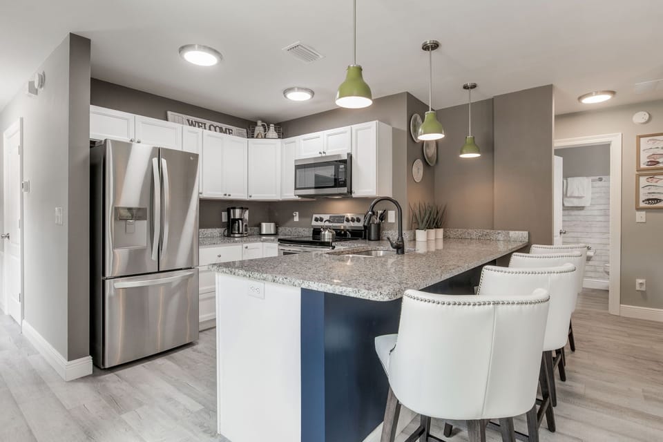The open-concept layout makes it easy to flow from kitchen to living and dining spaces.