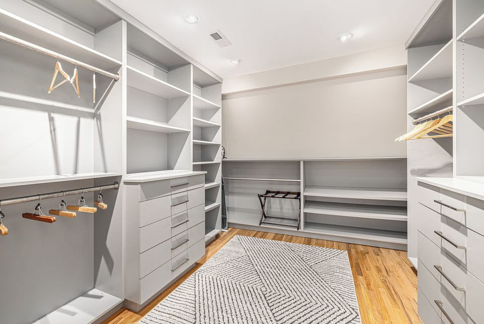 Spacious Master Closet with Ample Storage and Elegant Design
