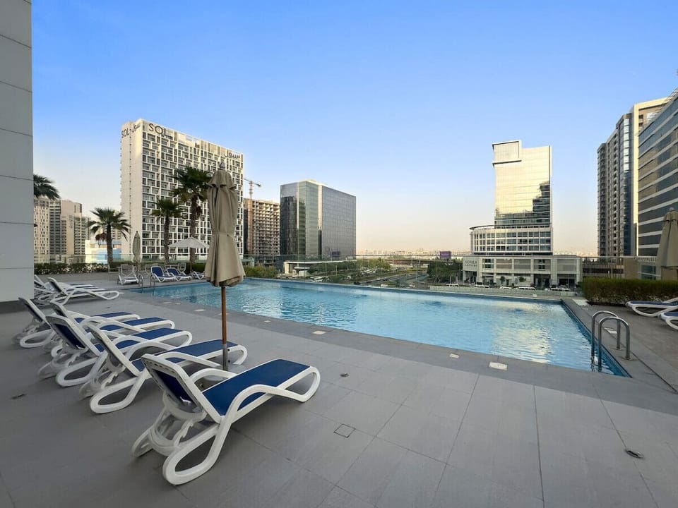 Poolside Paradise: Dive into luxury with stunning skyline views and refreshing turquoise waters!