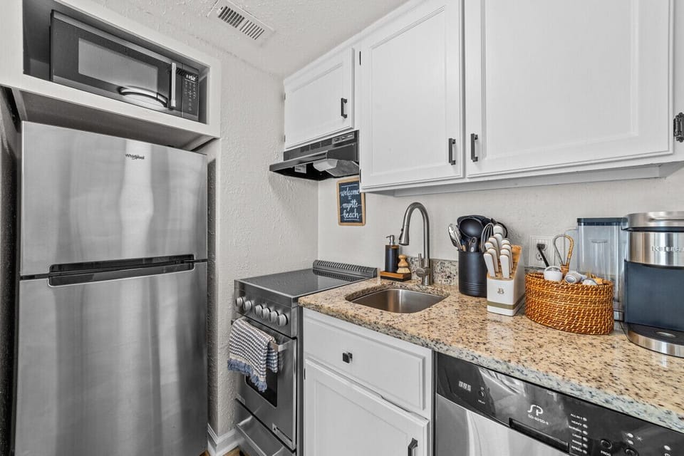 Fully equipped kitchen ready for homemade meals or quick bites before hitting the sand!