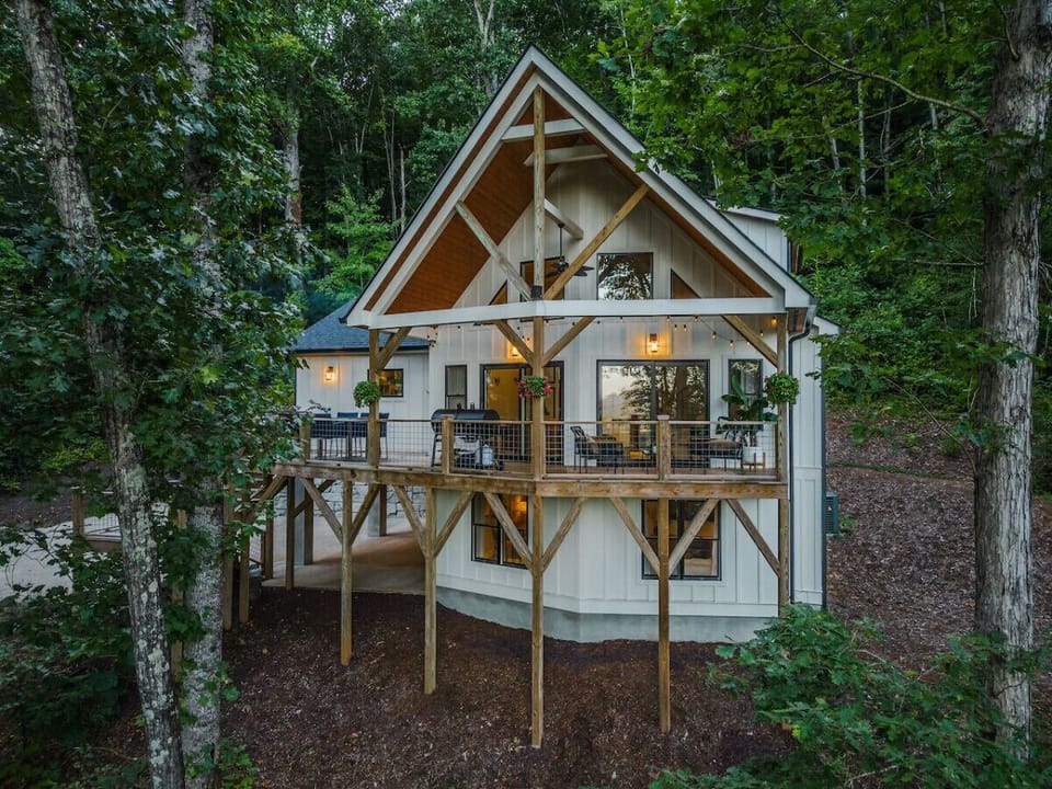 Newly built home surrounded by forest and trees.