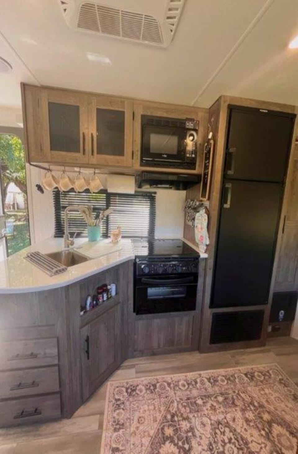 Kitchen - stove, oven, sink, microwave, fridge, separate freezer, and pantry.