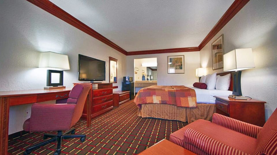 Settle in with roomy seating, big-screen TV, and desk.