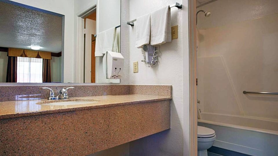 Refresh easily with a spacious vanity and shower-tub combo.