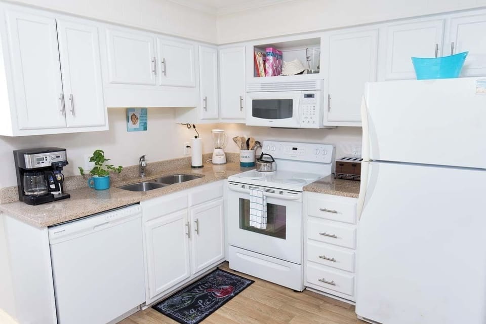 Kitchen - Kitchen with full-size appliances, cookware, and utensils — everything you need to prepare home-cooked meals during your vacation.