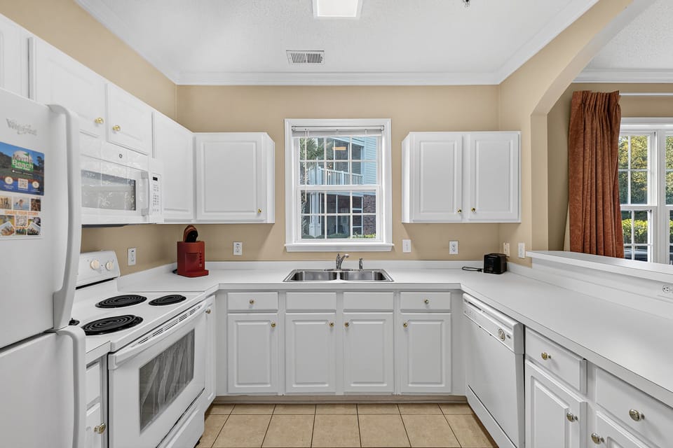 Kitchen - Full kitchen with modern appliances, cookware, and all the essentials for preparing meals during your stay.
