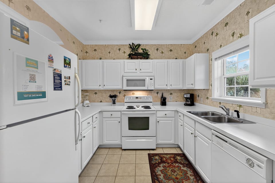 Kitchen - Full kitchen with modern appliances and all the essentials you need to prepare meals during your stay.