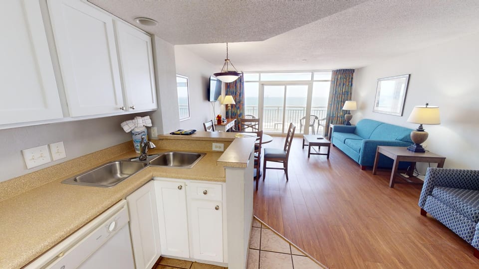 Kitchen - Whip up snacks or full meals in the fully equipped kitchen with stove, oven, refrigerator, dishwasher, and cookware.