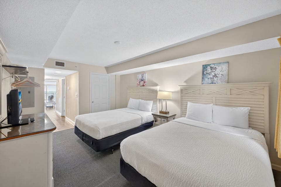 Bedroom - Rest peacefully in the cozy bedroom with soft linens — perfect after a day in the sun.