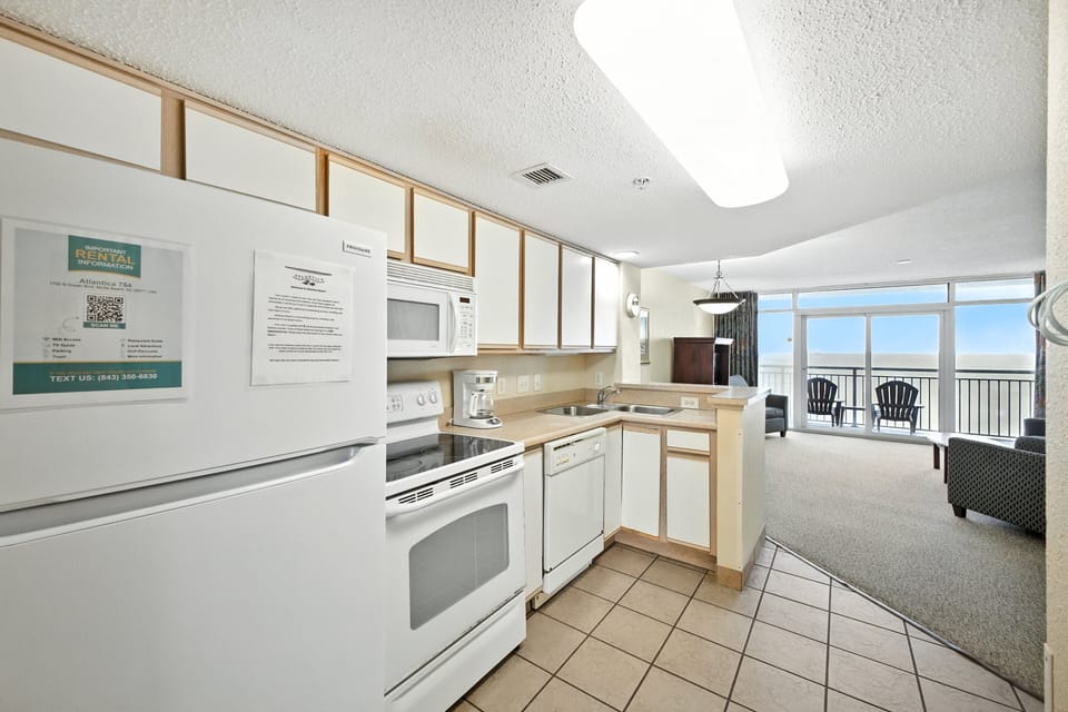 Kitchen - Whip up breakfast or dinner in the fully equipped kitchen with stove, oven, dishwasher, coffee maker, and more.