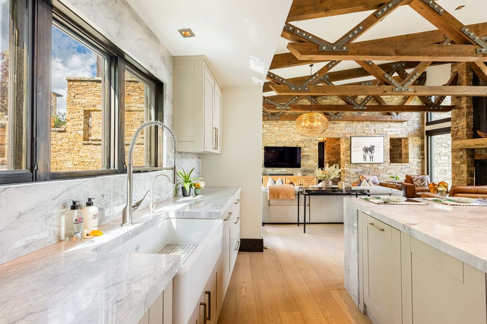 Gourmet kitchen with stone countertops and top-of-the-line stainless-steel appliances