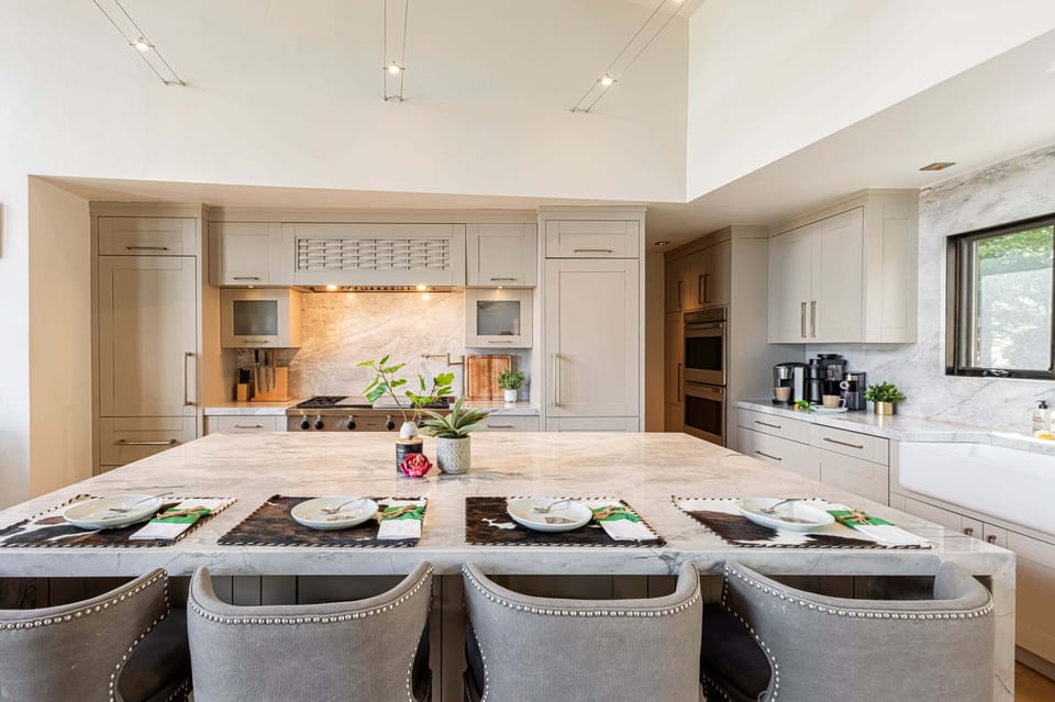 Large kitchen island offers bar seating for 4