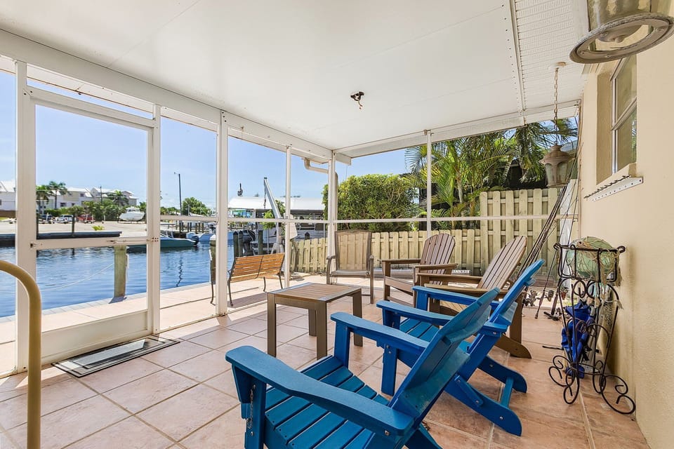 Screened lanai overlooking boat ramp and canal