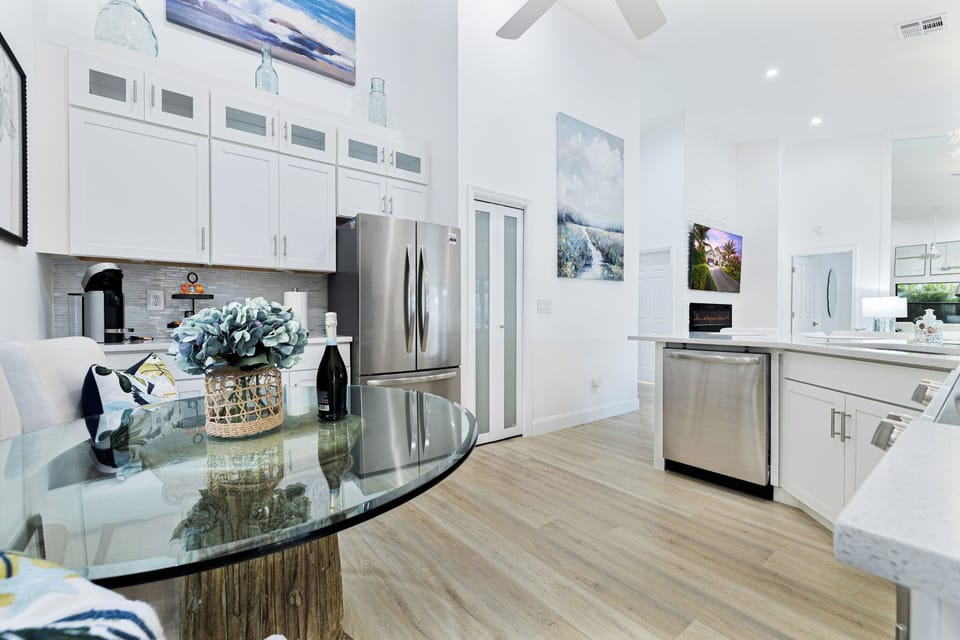 Stocked & modern kitchen with stainless steel appliances, including a dishwasher