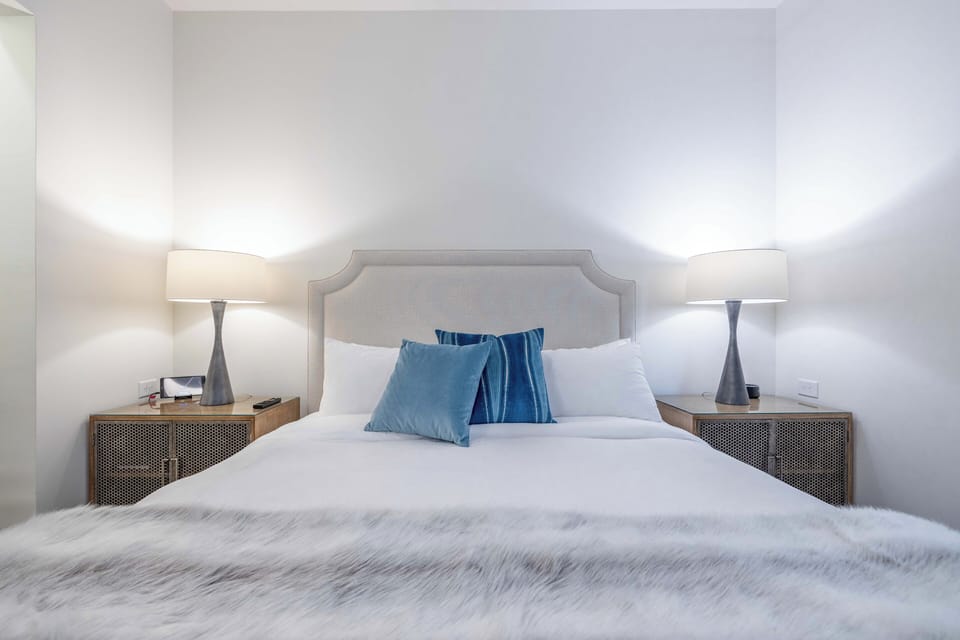 Spacious bedroom with ambient lighting