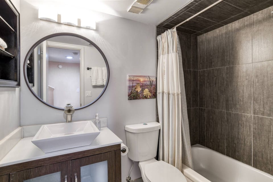 The second full bathroom is located next to the queen bedroom and features a tub shower combo.
