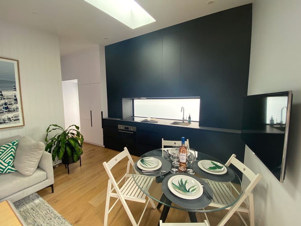 Dining table setting and fully equipped kitchen