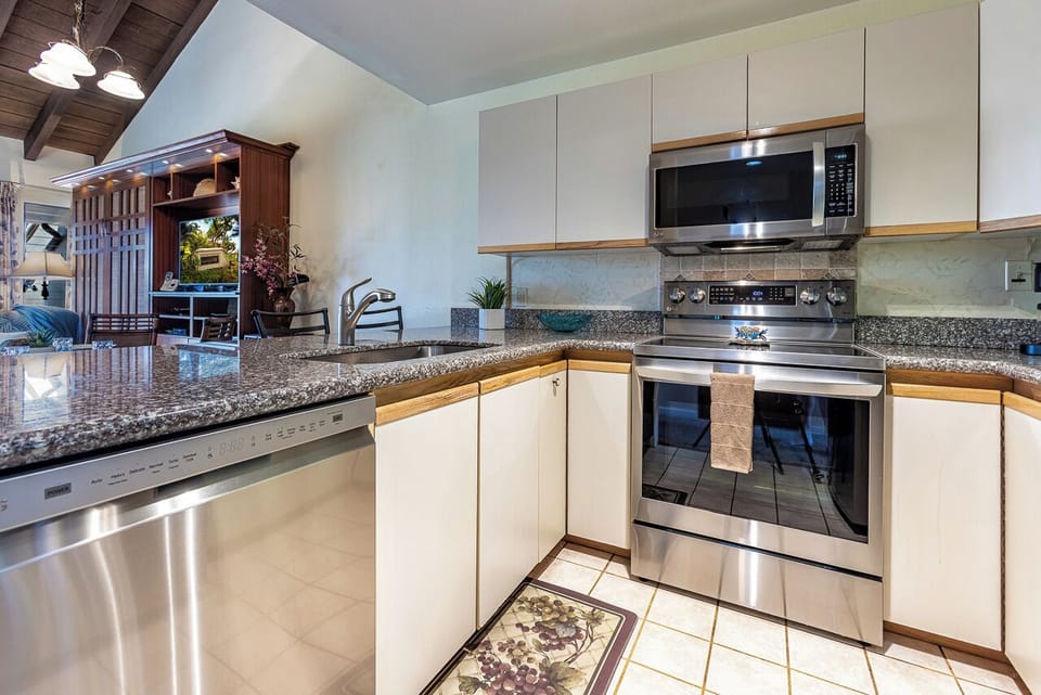 Step into your beautifully appointed kitchen with granite counters, stainless steel appliances, and everything you need to prepare meals in comfort and style.