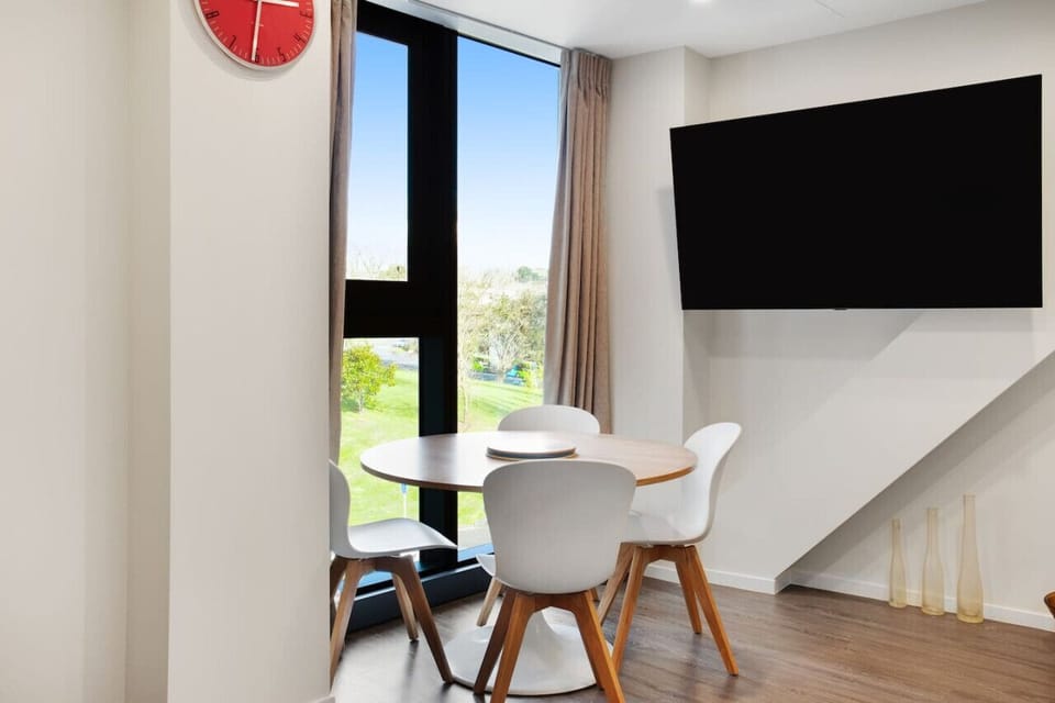 Sit at the dining table and enjoy the view over the park.