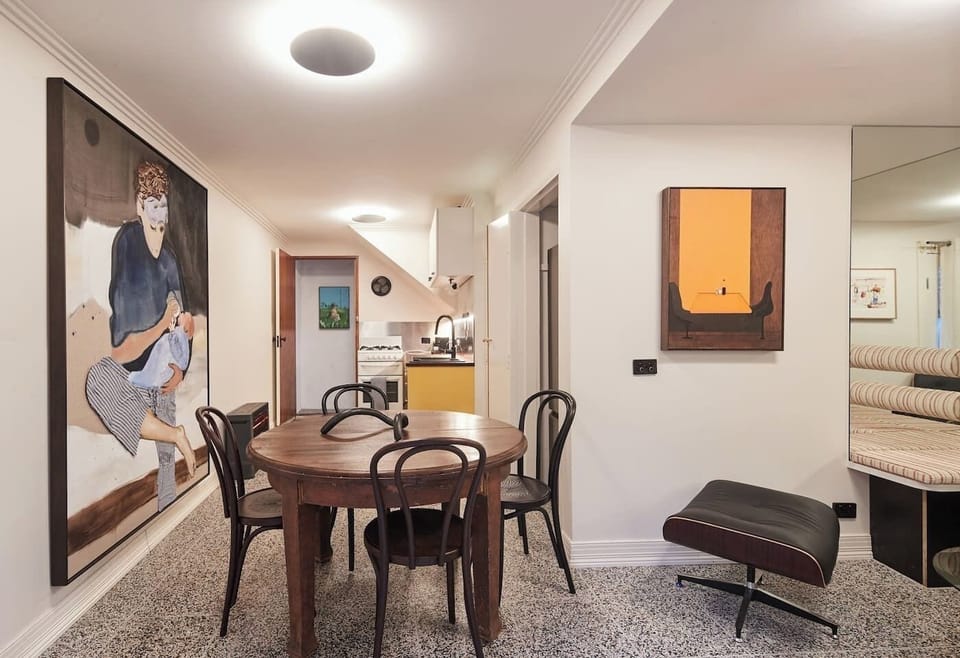 Bring home some pizza and open up a bottle of red wine to toast in this stylish dining area. 
