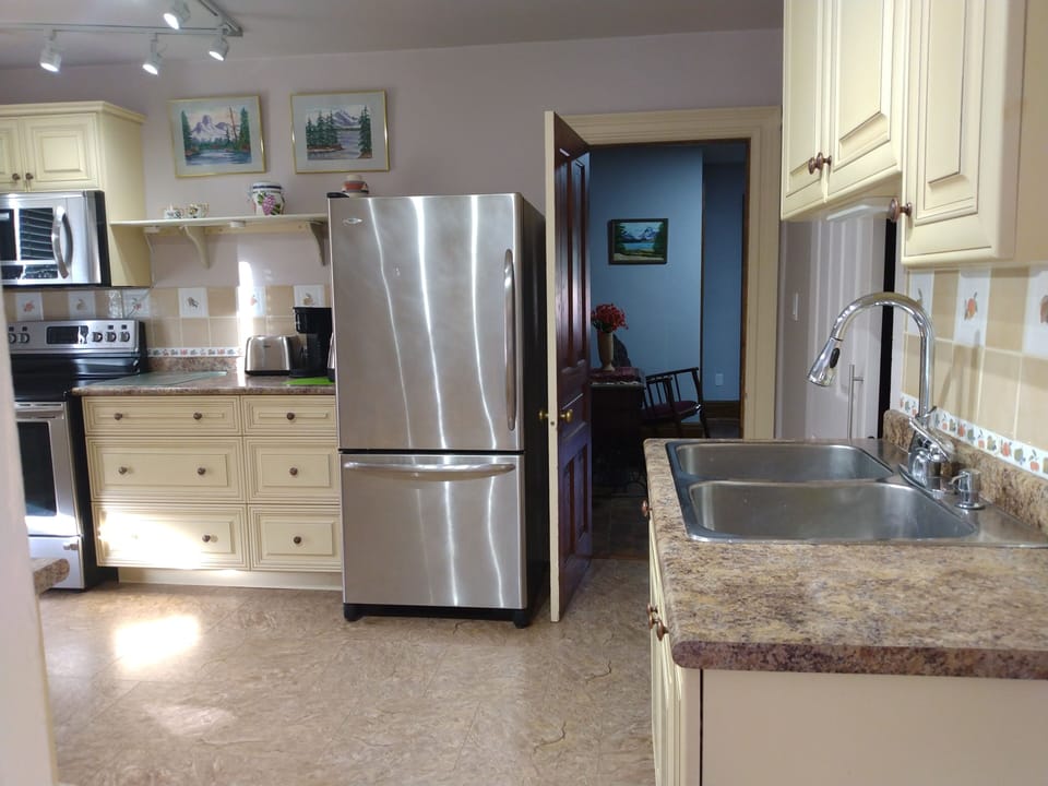 Kitchen, stainless microwave, fridge, freezer, stove, induction top, convection 