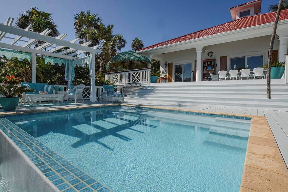 Expansive split level decks overlooking the Caribbean Sea, just one of the wonders of this luxurious 4 bedroom villa.