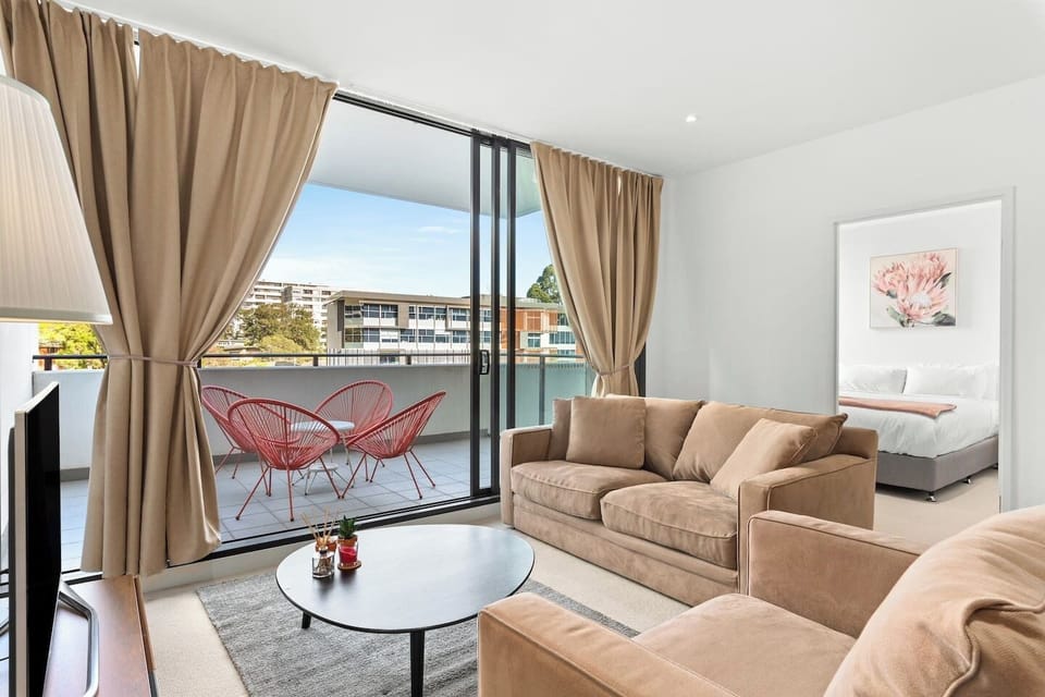 The living room flows through to the balcony, creating a lovely transition between indoors and out.
