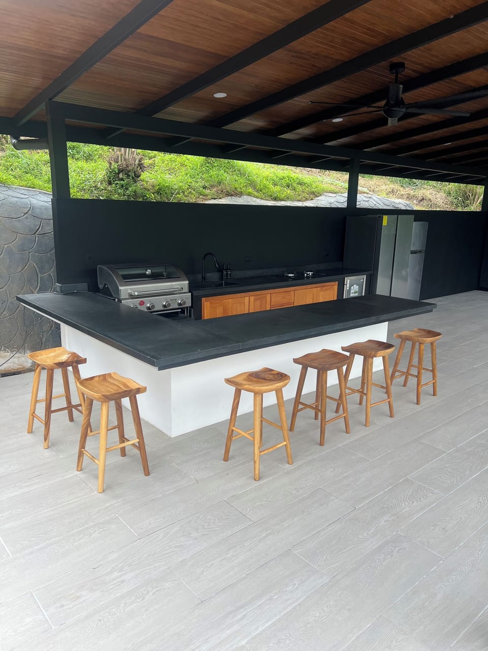 Outdoor dining area with bar and bbq