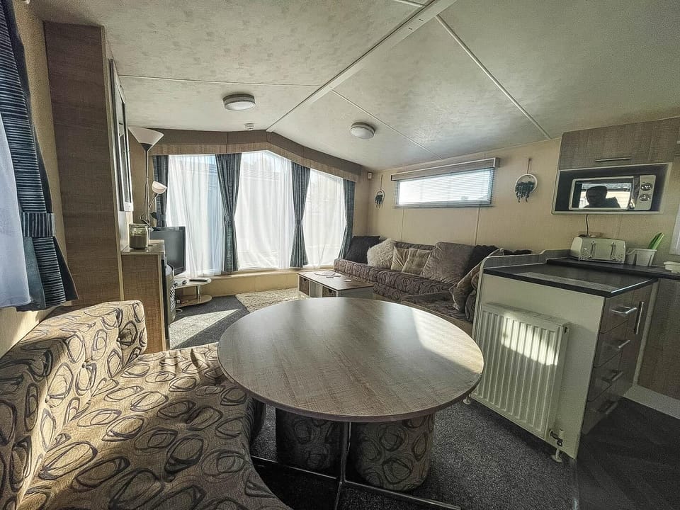 The comfortable living room in our caravan at California Cliffs Holiday Park is the perfect base for your UK holiday