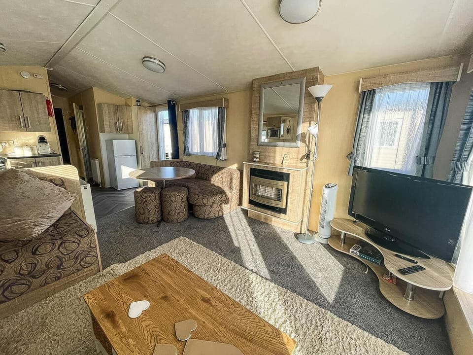Imagine your perfect seaside getaway starting in the comfortable living room of our caravan at California Cliffs Holiday Park