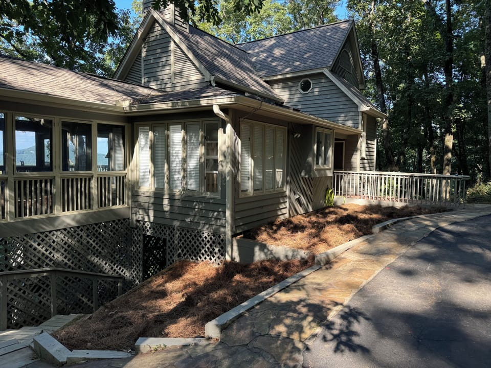 Level driveway with no stairs into the home