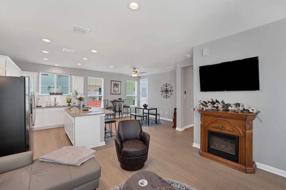 The electric fireplace adds a cozy ambience.