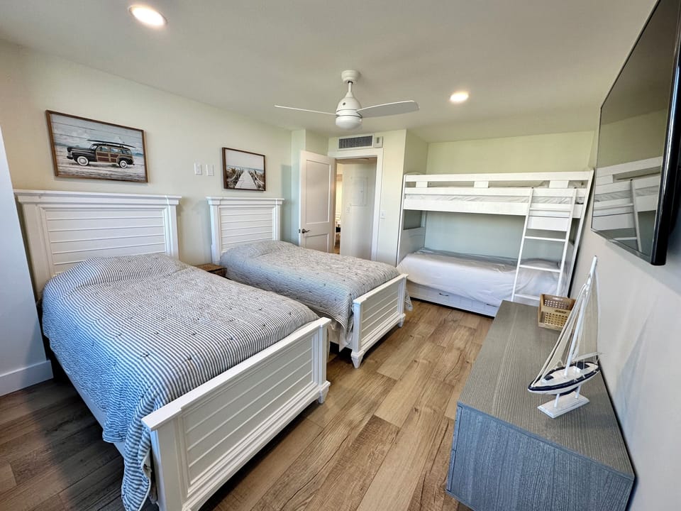 Guest Bedroom with 2 twin beds and a twin bunk bed.  
