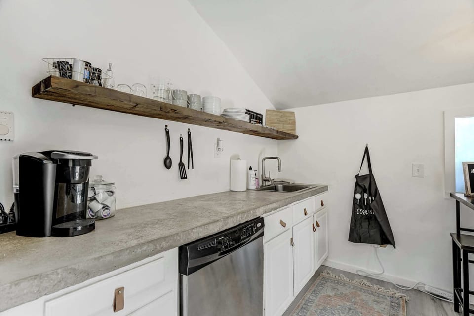 Cook up your favorite meals in this fully equipped kitchen, complete with modern appliances and everything you need for a comfortable stay.