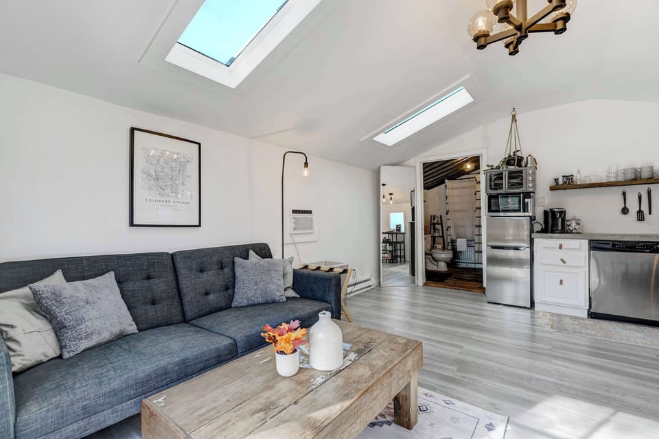Enjoy the spacious open-concept design of this studio, featuring a fully equipped kitchen, cozy living area, and a comfortable bed—all under a bright skylight for a welcoming ambiance.