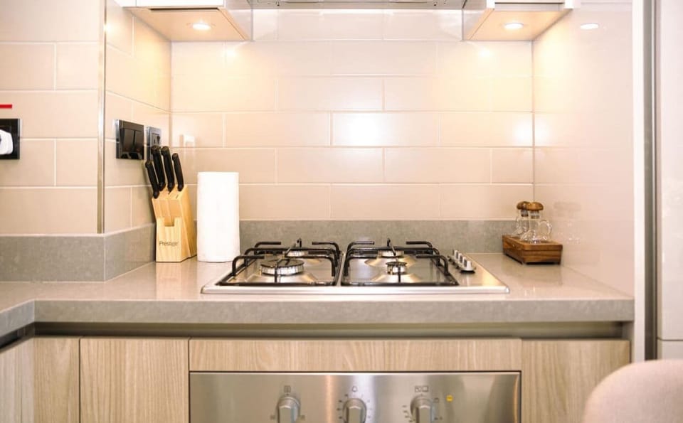 The fully equipped kitchen is a culinary haven, complete with modern appliances and ample counter space, making meal preparation a breeze.